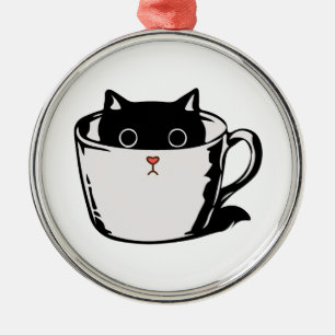 Black kitten with red nose hiding in a cup metal tree decoration