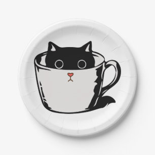 Black kitten with red nose hiding in a cup paper plate