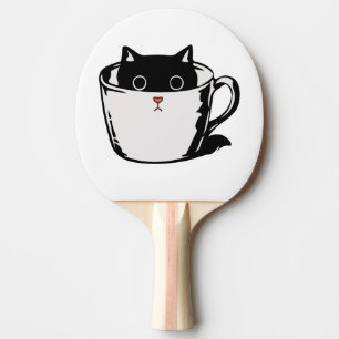 Black kitten with red nose hiding in a cup ping pong paddle