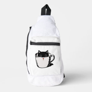 Black kitten with red nose hiding in a cup sling bag