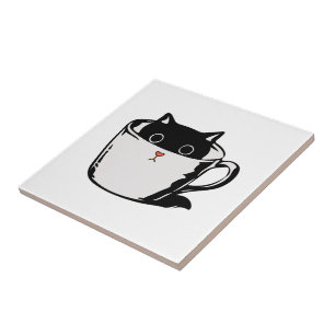 Black kitten with red nose hiding in a cup tile