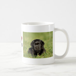 Black labrador retriever puppy coffee mug