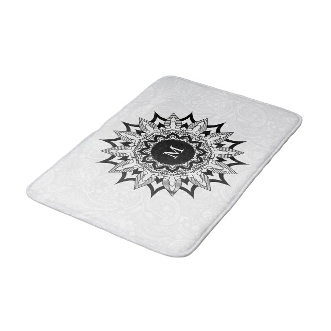 Black mandala on a white paisley bath mat (Angled)