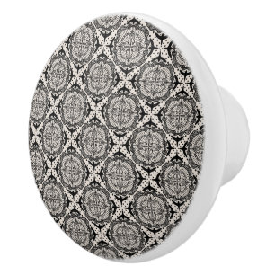 Black medallion and birds, scrollwork ceramic knob
