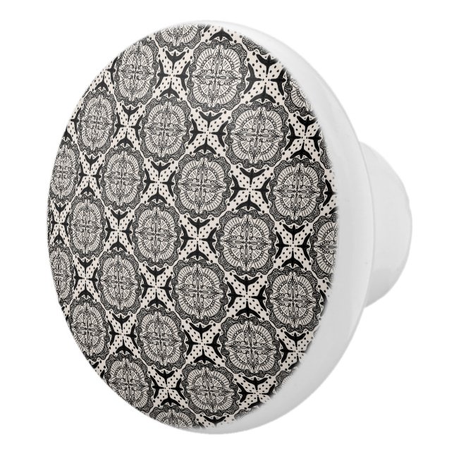 Black medallion and birds, scrollwork ceramic knob (Right)