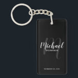 Black Modern Script Personalised Groomsmen Key Ring<br><div class="desc">Add a personal touch to your wedding with personalised groomsmen keychain. This keychain features personalised groomsmen's name in white modern script font style and monogram in light grey modern script font style as background with title and wedding date in white modern sans serif font style on black background. Also perfect...</div>