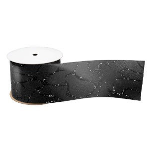 Black monochromatic glittery background satin ribbon