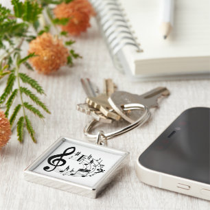 Black musical notes in oval shape key ring