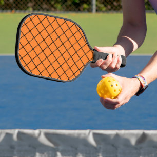 Black net mesh on orange pickleball paddle