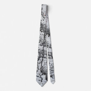 black paint drip on concrete tie