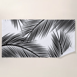 Black palm leaves on white background beach towel