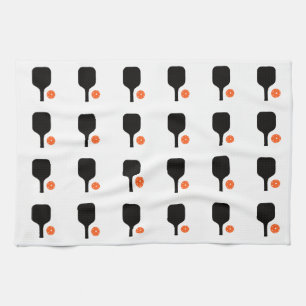 Black pickleball paddles & orange balls towel