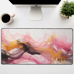 Black Pink Gold Abstract Liquid Waves Personalised Desk Mat<br><div class="desc">Unveiling our Personalised Black, Pink, and Gold Liquid Waves Mat. This captivating design showcases an abstract pattern of fluid waves in an elegant harmony of black, pink, and gold tones. The striking contrast creates a luxurious feel, while the personalised feature adds a unique touch to this design. This radiant piece...</div>