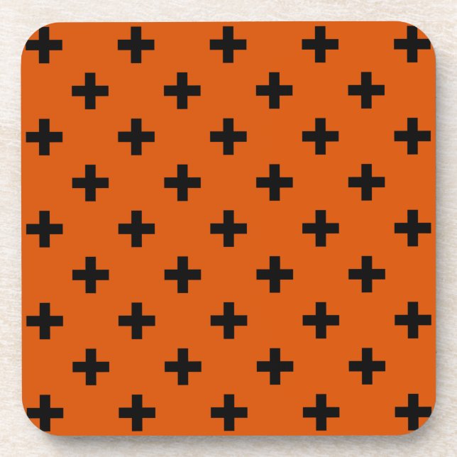 Black polka crosses on orange coaster (Front)