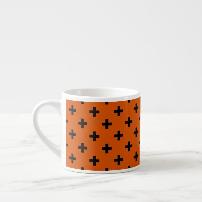 Black polka crosses on orange espresso cup (Left)