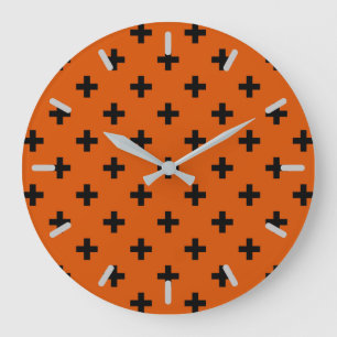 Black polka crosses on orange large clock