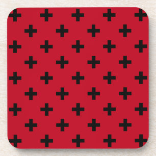 Black polka crosses on red coaster