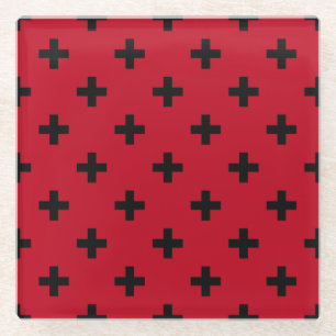 Black polka crosses on red glass coaster