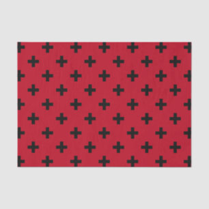 Black polka crosses on red tissue paper