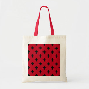 Black polka crosses on red tote bag