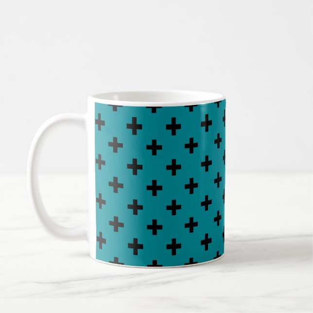 Black polka crosses on teal coffee mug (Left)