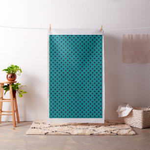 Black polka crosses on teal fabric