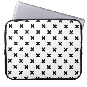 Black polka crosses on white laptop sleeve