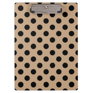 Black polka dots on beige clipboard