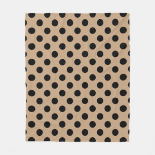 Black polka dots on beige fleece blanket