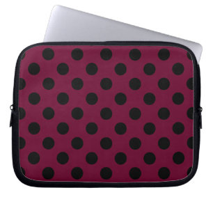 Black polka dots on burgundy laptop sleeve