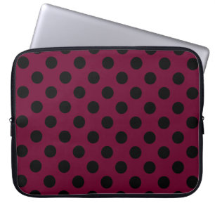 Black polka dots on burgundy laptop sleeve