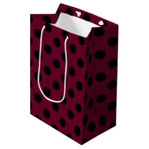 Black polka dots on burgundy medium gift bag