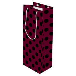 Black polka dots on burgundy wine gift bag