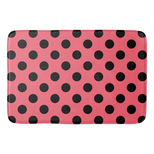 Black polka dots on coral bath mat (Front)