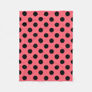 Black polka dots on coral fleece blanket