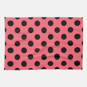 Black polka dots on coral tea towel