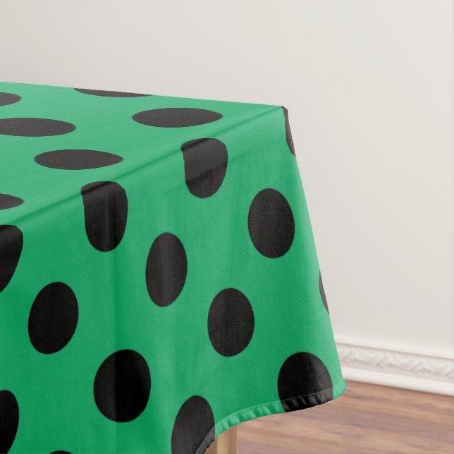 Black polka dots on fresh green tablecloth (In Situ)