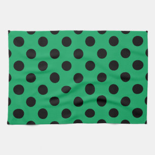 Black polka dots on fresh green tea towel