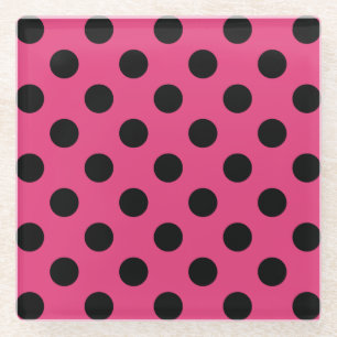 Black polka dots on fuchsia glass coaster