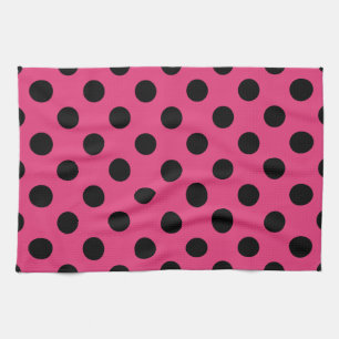 Black polka dots on fuchsia tea towel
