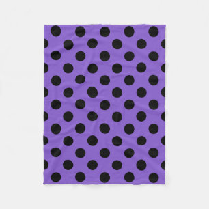 Black polka dots on lavender fleece blanket