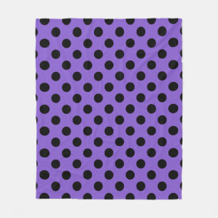 Black polka dots on lavender fleece blanket
