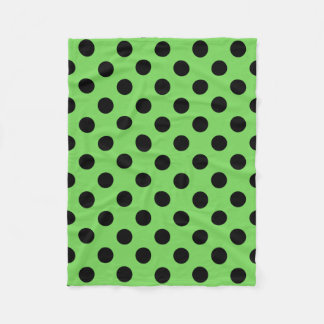 Black polka dots on lime green fleece blanket