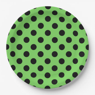 Black polka dots on lime green paper plate