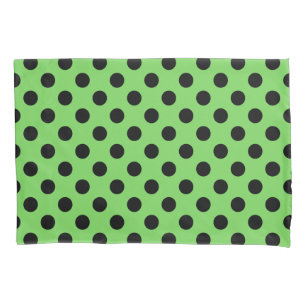Black polka dots on lime green pillowcase