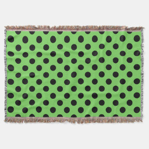 Black polka dots on lime green throw blanket