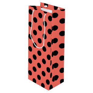 Black polka dots on living coral wine gift bag