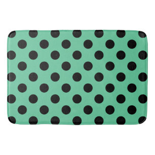 Black polka dots on mint green bath mat