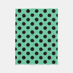 Black polka dots on mint green fleece blanket