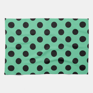 Black polka dots on mint green tea towel